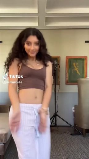 Teeny-bopper shows off her round ass and perky tits