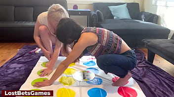 A sexy twister game with a big tits blonde and a skinny hot brunette