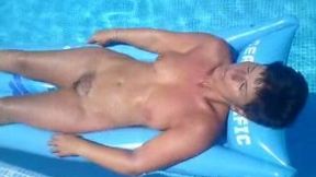 My beautiful brunette wife takes sunbath on air mattress all naked