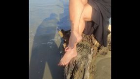 Beautiful woman with big legs crossed on the beach (1)