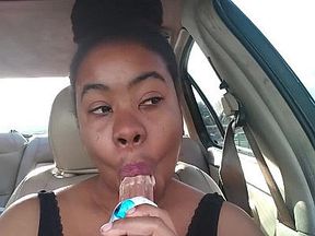 Ebony Big Lips Sucking Ice cream Pop Outside in Car - Cami Creams