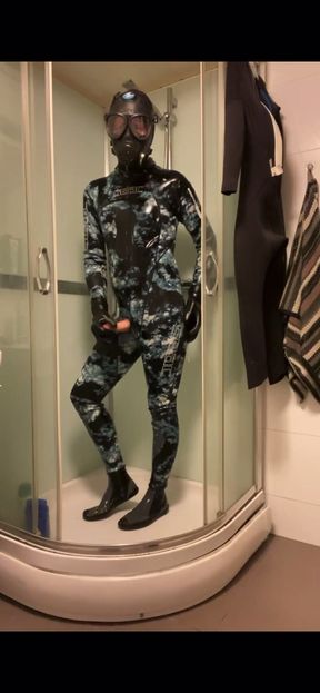 Wetsuit and gasmask in the shower