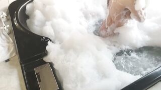 brunette washes her big tits in hydromassage