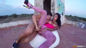 Blindfolded, ebony darling with curly hair is sucking dick to make it hard enough for her pussy