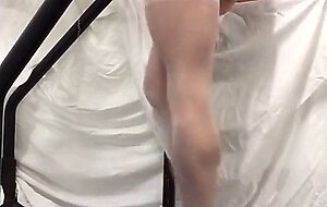 Crossdresser in White Stockings on Treadmill