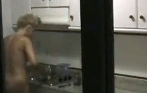 Naked in the kitchen
