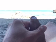 Slow motion cumshot on public beach