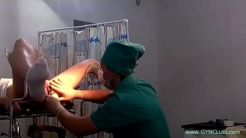 A girl in white socks on a gynecological chair