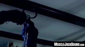 MuscleJockBound.com - Muscular man silenced with a ball gag while being heavily chain