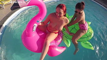 TWO YOUNG REDHEADS PLAYING IN THE POOL GOING TOPLESS IN THE SUN FOR YOU