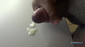 check out how this black cock bust a huge and creamy nut on a table
