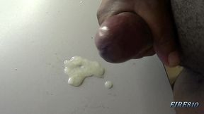 check out how this black cock bust a huge and creamy nut on a table