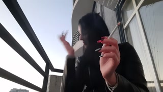 Smoking fetish from sexy Dominatrix Nika. Pretty woman blows cigarette smoke in your face