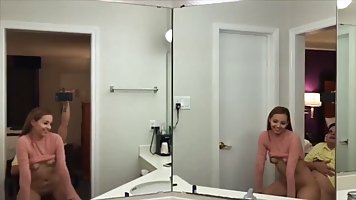 Brunette with small tits is getting fucked in front of the web camera, from the back