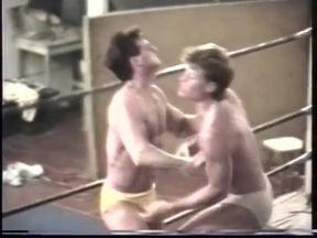 Two sexy men wrestle with wedgies in briefs