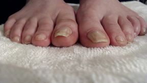 Long natural toenails oiled feet