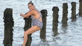 Naked MILF enjoys skinny dipping in the ocean