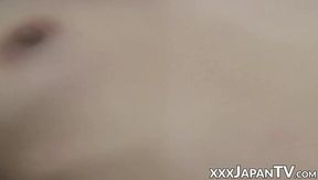 Lazy Asian unbuttons blouse and drums her clit to gasping climax