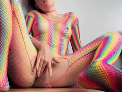 Teen in Rainbow Fishnets Fingers Herself