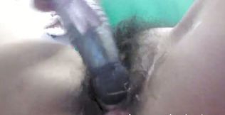 Lusty bitch tickles her greasy pussy with her rabbit vibrator