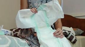 Spanked and diapered for wetting the bed