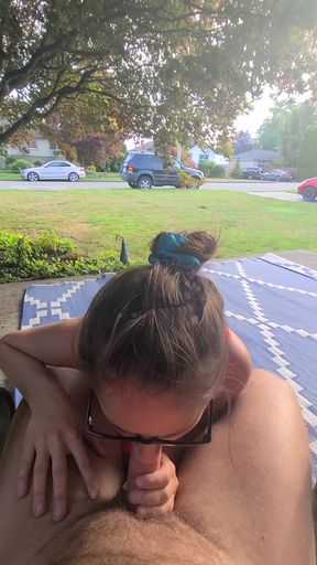 Real-life couple enjoys a public outdoor blowjob in an open space with other amo