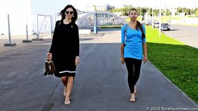 Anastasia and Kristina with huge feet barefoot on an asphalt field (Part 1 of 4) #20220420