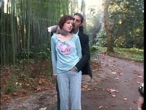 Two men dominating of a woman and a shemale