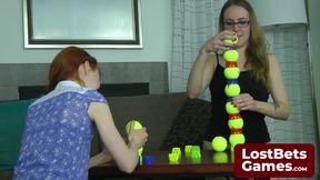 Two lesbians in an intimate Strip Ball Stacks challenge