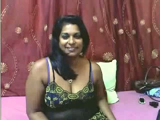 Sweet and busty mature Indian lady on webcam teasing