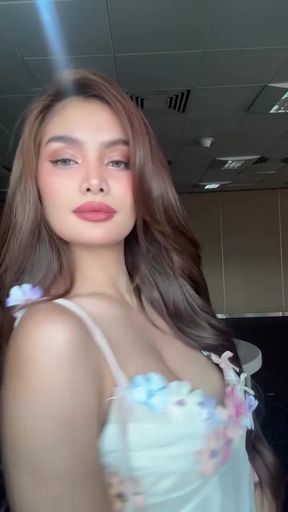 Curvy Filipina celebrity shows off her body in a sultry pose