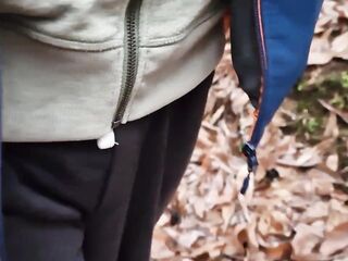 Dude walks with his dong out, jerks off and cums in the forest