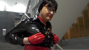 Tranny in a hot vinyl outfit flaunts herself in public parking garage