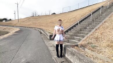 A tailored sailor suit gives her MILF curves a public tease