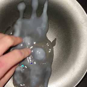 Huge cumshot on a plate with some cumplay