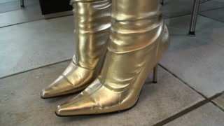 Big Tits Girl In Black Latex Catsuit + Mask + Gloves Piss In Golden Boots