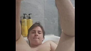 Chubby boy jerks off and cums in bathtub