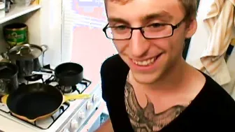 Tattooed twink strokes his big cock in solo masturbation