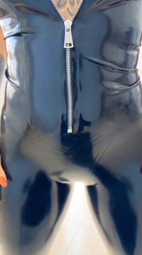 Blonde latex babe shows off her big ass