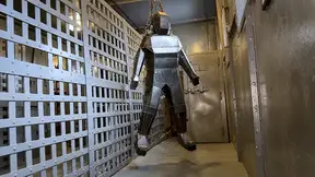 Encased in Steel - Heavy and Elise Graves - Heavy is locked inside a heavy steel person-shaped tomb before being taunted