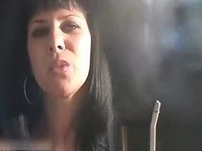Sexy brunette hoe smokes a cigarette