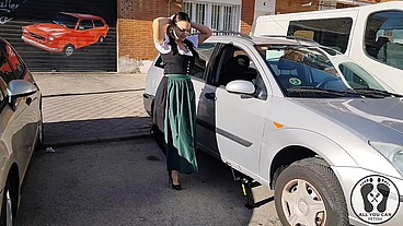 DIRNDL SLUT GETS DIRTY AND OILY CHANGING TIRES