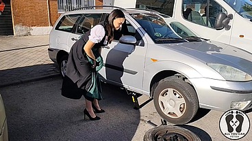 DIRNDL SLUT GETS DIRTY AND OILY CHANGING TIRES