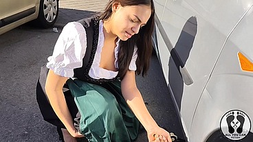 DIRNDL SLUT GETS DIRTY AND OILY CHANGING TIRES