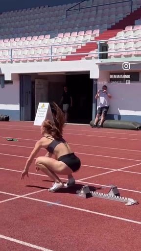 Female athlete stretching in stadium