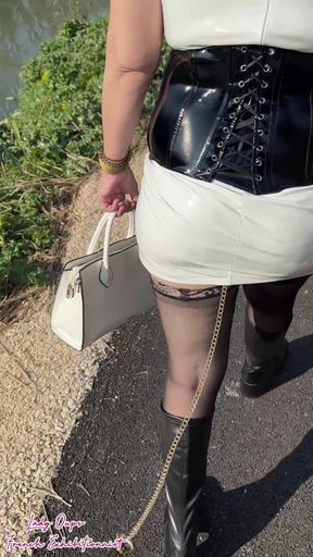 Outdoor Walk in a Latex Dress with an Anal Plug and a Leash in the Ass
