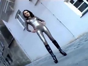 Girl has to walk in latex catsuit on the street because she lost a bet