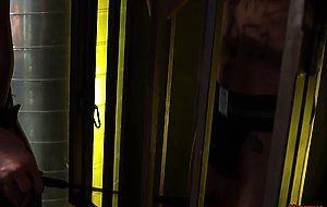 Liam Skye watches Tristan Hunter from a steel cage