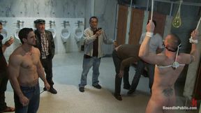 The Wrestler Gets Gang Banged by a Horny Crowd in a Public Restroom for Losing His Match.