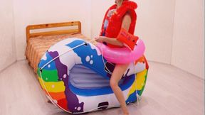 Alla inflates herself inside a swimsuit with a beach ball and fucks an inflatable boat hot!!!